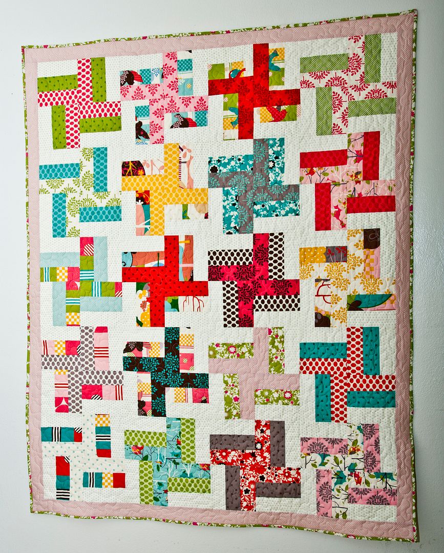 Lella Boutique's Dizzy Spell quilt. A perfect beginner quilt using fat quarters, a jelly roll, or layer cake.