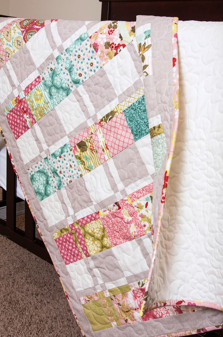 Lickety Split disappearing 4-to-9 patch baby quilt pattern using 2 charm packs. Cute baby quilt by Lella Boutique using Hello Luscious fabric by BasicGrey for Moda Fabrics.