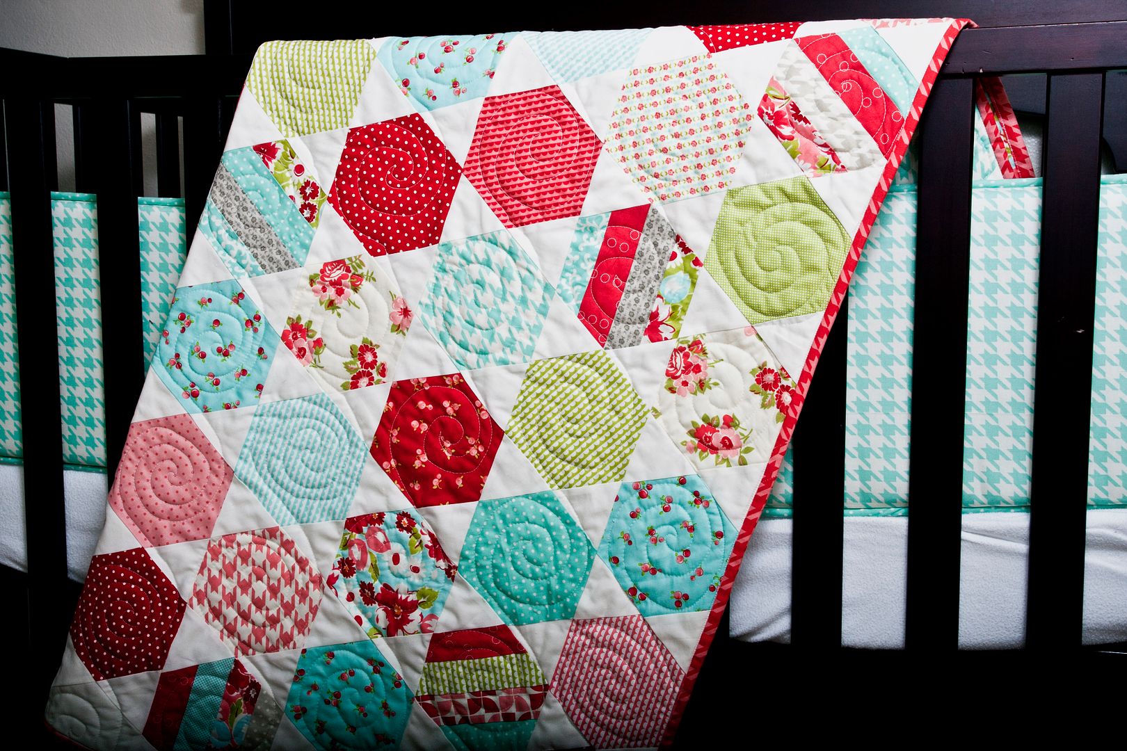 Juggle hexagon quilt PDF pattern by Thimble Blossoms. Makes a sweet baby quilt in these Ruby fabric by Bonnie & Camille for Moda Fabrics.